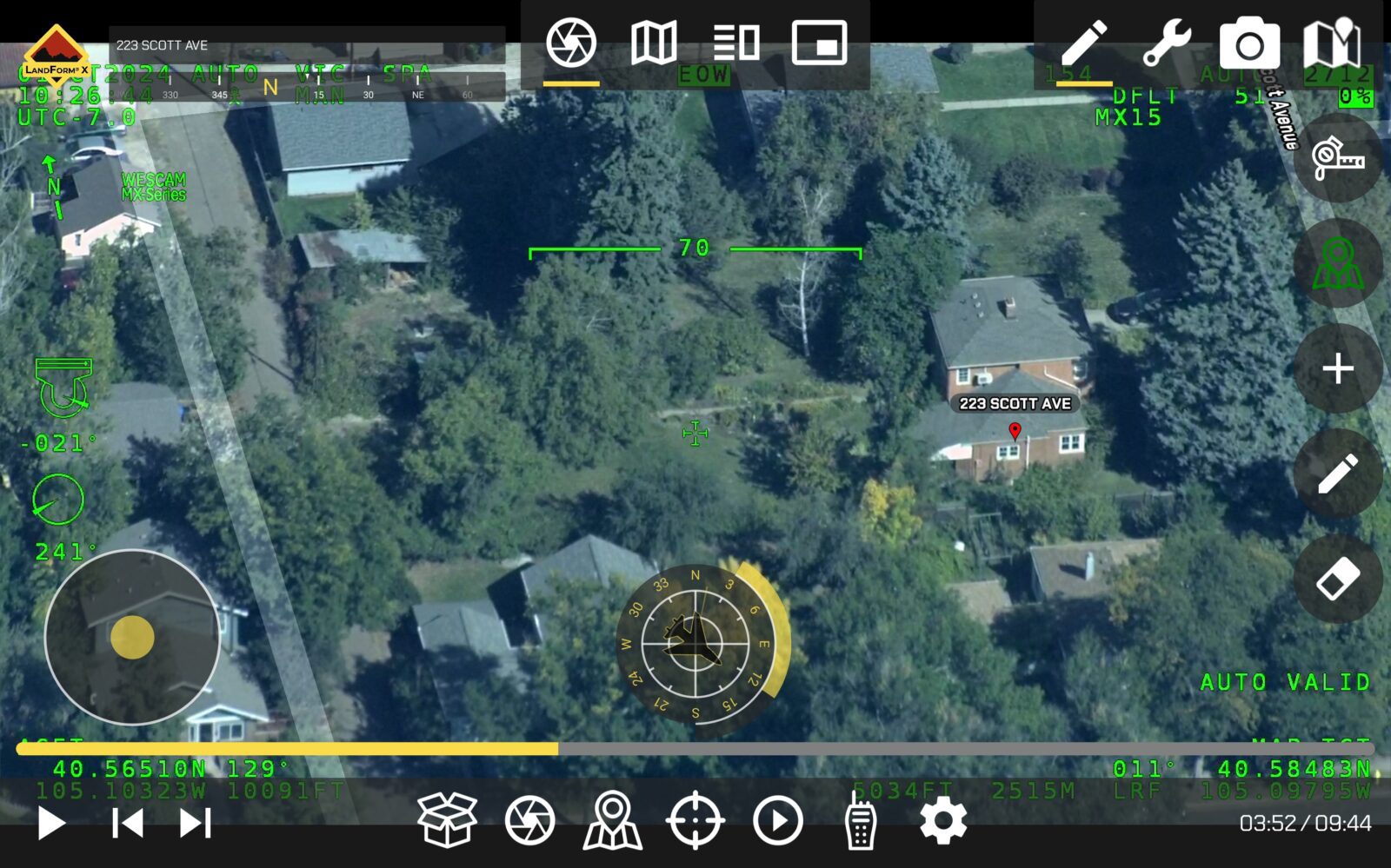 Aerial view of a residential area with trees and houses, displaying coordinates and various instrumentation data overlay, including a highlighted house labeled "223 SCOTT AVE.