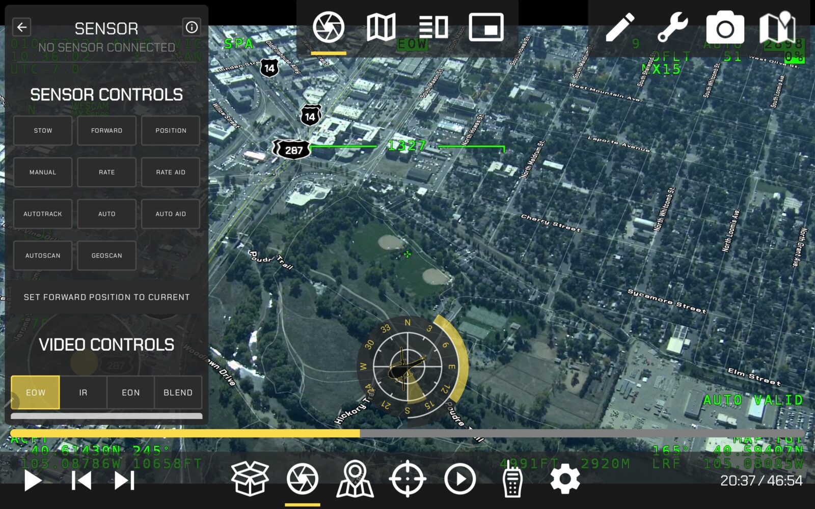 Aerial view of a city with sensor controls overlay. Interface shows options for sensor and video controls, map features, and various data in green text.